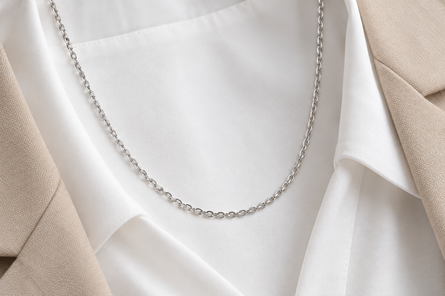 Clean collarbone chain displayed with white apparel styling